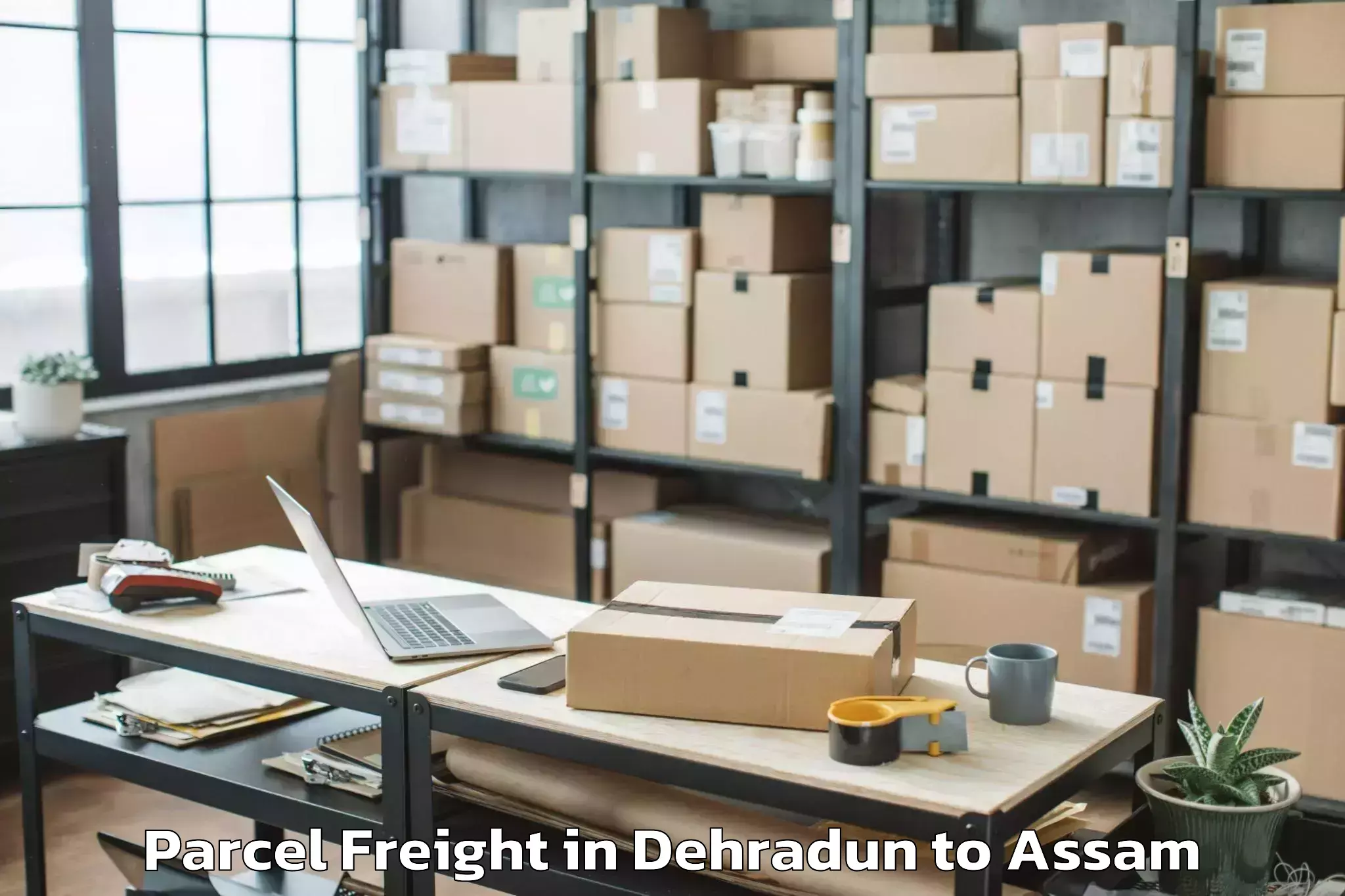 Affordable Dehradun to Sarthebari Parcel Freight